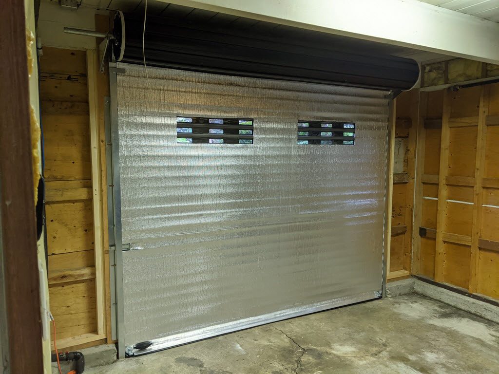 Insulated roll up door with windows